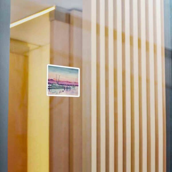 Modern office interior with wooden slat walls and a digital art picture of a boat dock at sunset.
