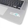 Impartial Inc. sticker on a silver laptop with keyboard, promoting unbiased legal services.