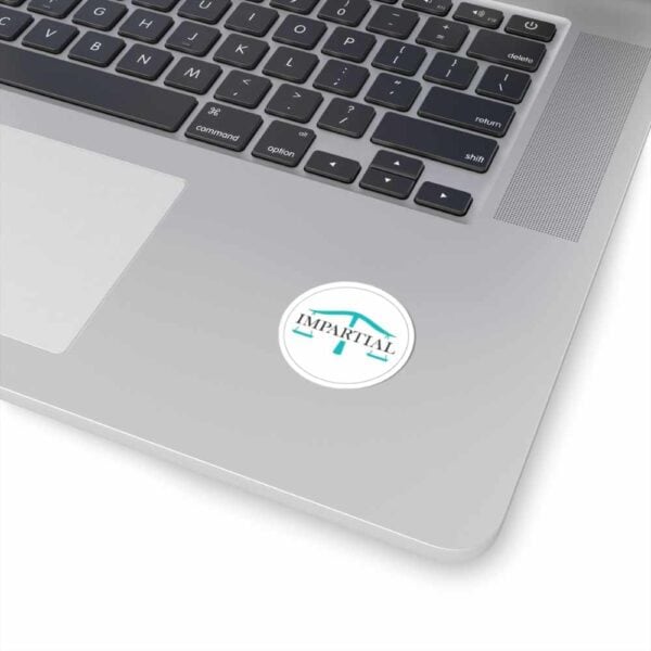 Clean MacBook keyboard with Impartial, Inc. logo for professional unbiased tech solutions.