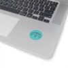 Ambiguous logo sticker on laptop with keyboard, representing impartiality and fairness.