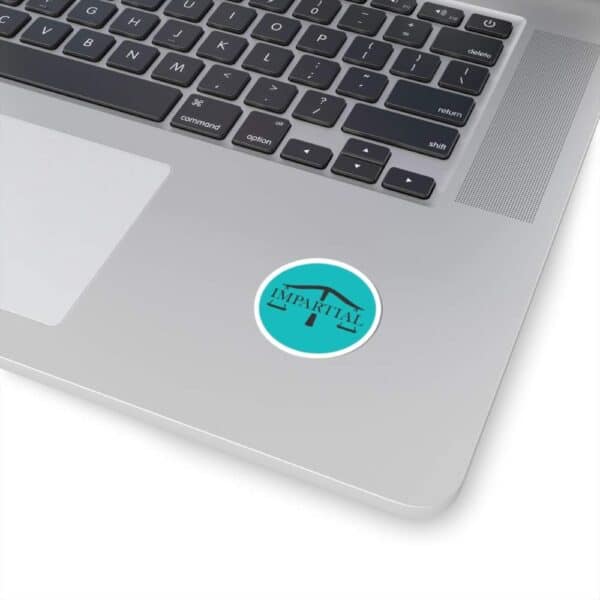 Clear laptop keyboard with "Impartial" logo sticker for unbiased information and tech focus.